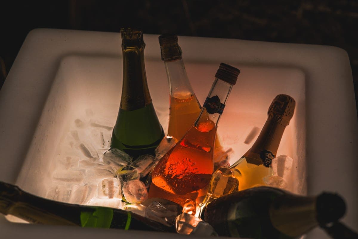 Champagne bottles chilling in a metal ice bucket