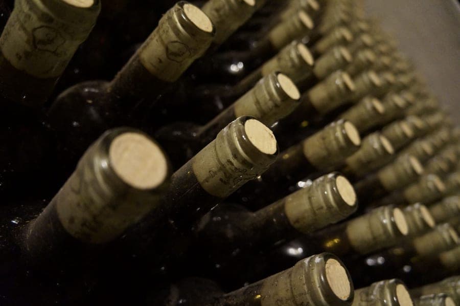 A wine preservation pump fitted to the neck of a bottle